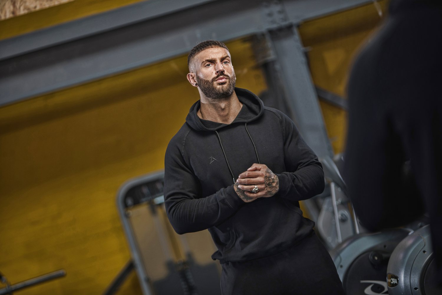 Training in Alpha Skinz crimson hoodie